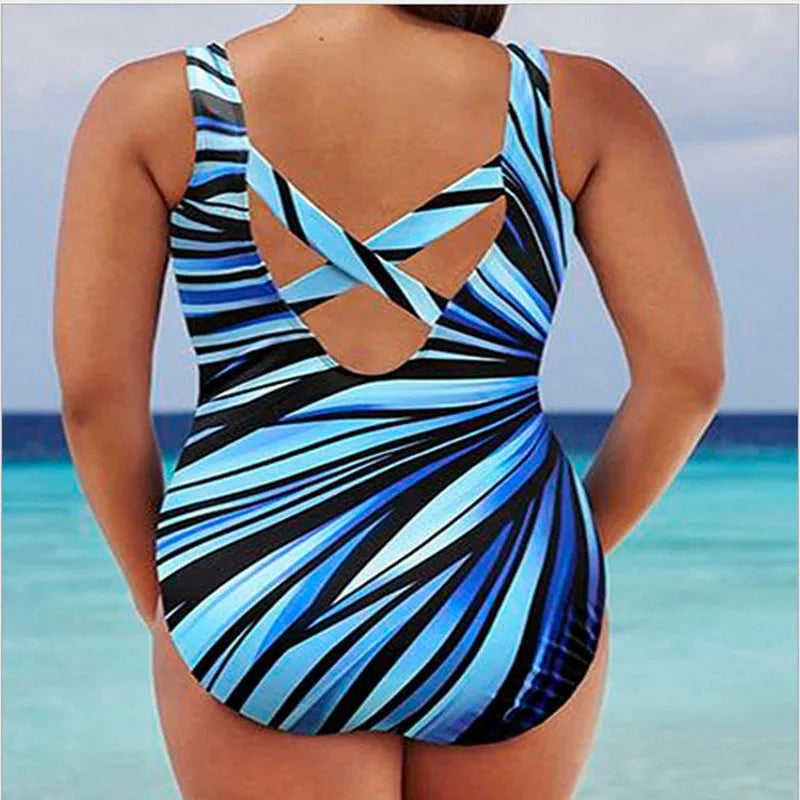 Traje de baño monokini a rayas de Alessia Madrid, estilo moderno y cómodo para nadar o tomar el sol.
