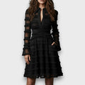 Vestido midi transparente con flecos de Alessia Madrid, diseño elegante y moderno para ocasiones especiales.