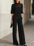 Conjunto de tres piezas en negro de Alessia Madrid, top y pantalones de pierna ancha, para un estilo elegante y cómodo