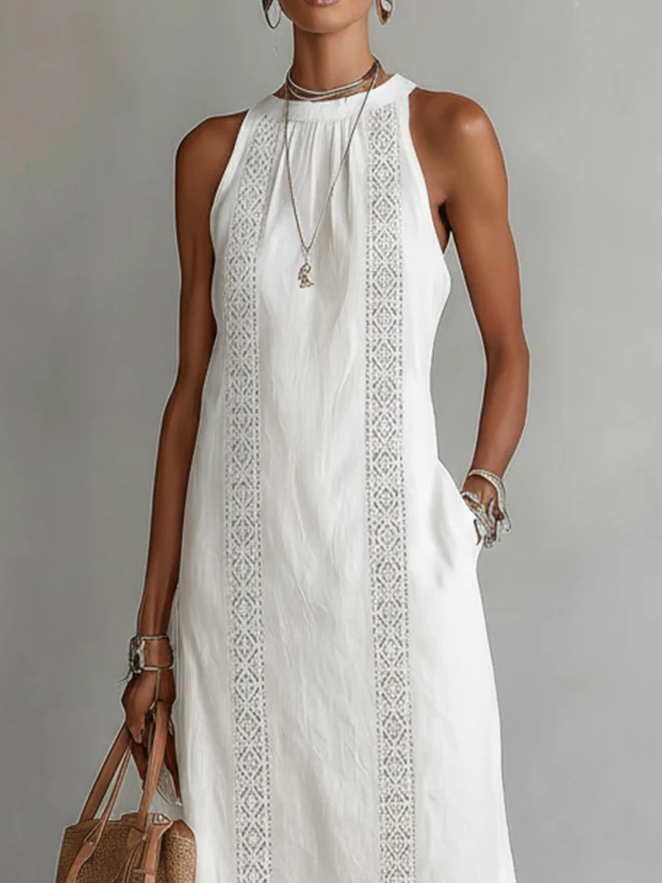 Vestido midi de lino Jimena de Alessia Madrid con cuello mao y diseño elegante en color neutro.